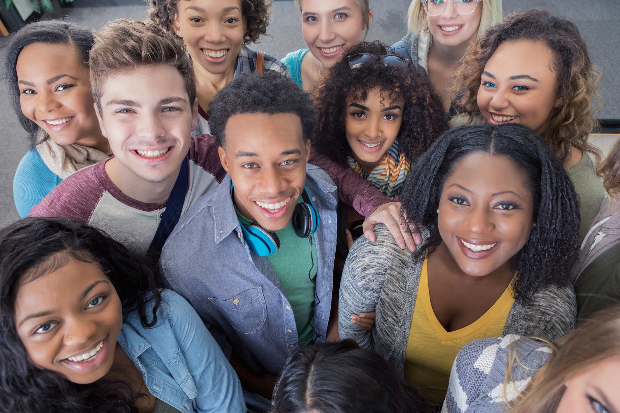 Diverse group of smiling young adults - The Giving Crowd