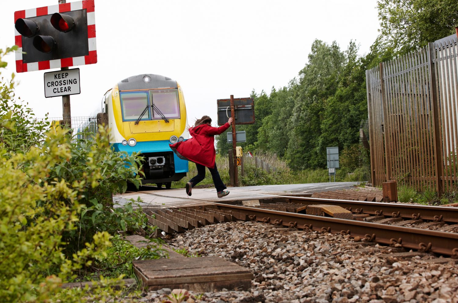 woman-running-out-in-front-of-moving-train-the-giving-crowd